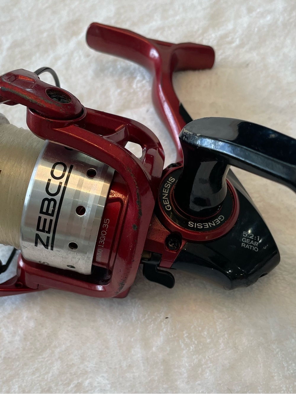 Men’s Zebco Genesis Size 30 Spinning Reel in Red and Black